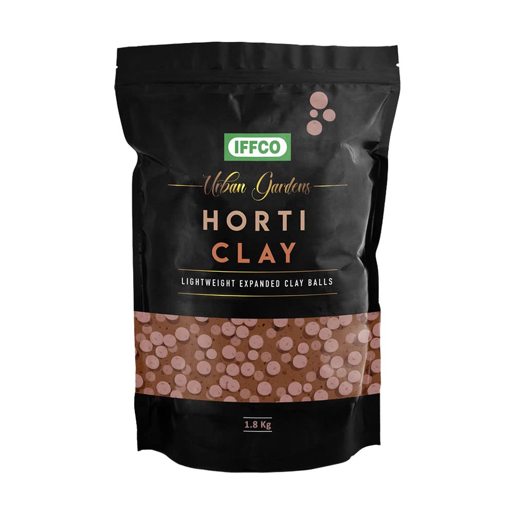 Clay balls mulch in plant pot to retain moisture and protect roots from heat waves in India